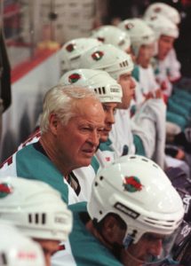 Gordie Howe sits on the Detroit Vipers' bench with his International Hockey League teammates during the first period against the Kansas City Blades in Auburn Hills, Mich., on Friday, Oct. 3, 1997. Howe, 69, who played a 48-second shift in the first period, became the first professional hockey player to play in six decades.(AP Photo/Jeff Kowalsky)
