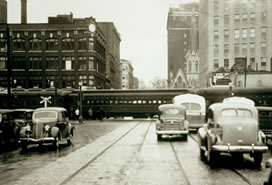 sepia photo of cars, train